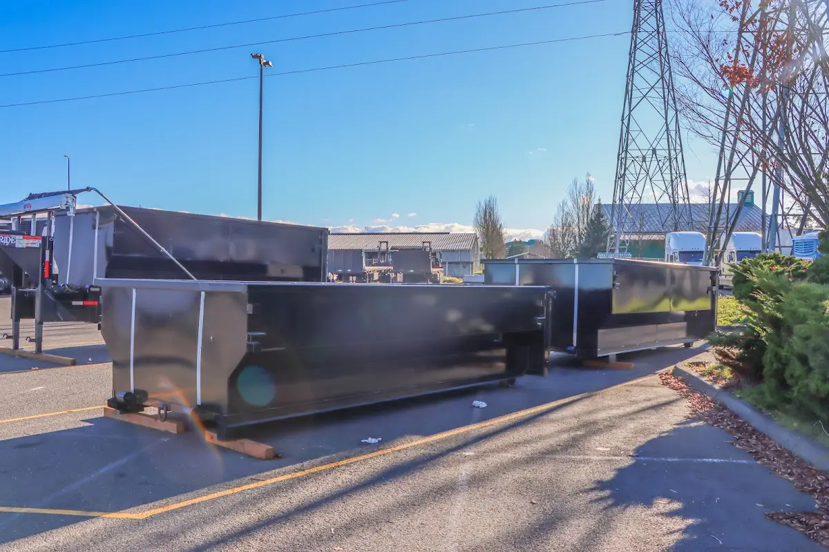 Roll-off dumpster ready for waste disposal at job site for 15 Yard Dumpster Rental in Eugene